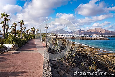 View of the embankment at low tide, Playa Blanca, Canaries, Spain Editorial Stock Photo