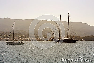 View of the embankment and yachts of the island of Paros Greece in a spring evening Stock Photo