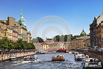 View of the embankments of the Moika river, tourist boats, the Red bridge and the Trading house `S. Esders and K. Skheifals` in Editorial Stock Photo