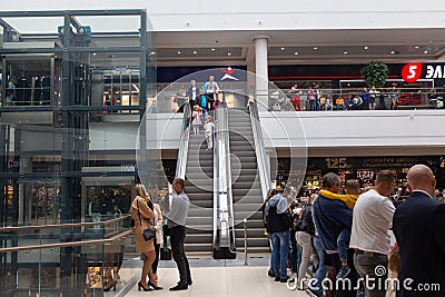 View on escalator in modern shopping mall Triniti Editorial Stock Photo