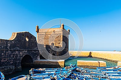 View of Essaouira port with blue fishing boats, Essaouira, Morocco. Copy space for text Editorial Stock Photo