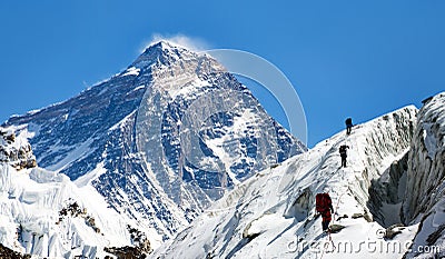 View of Everest from Gokyo valley with group of climbers Stock Photo