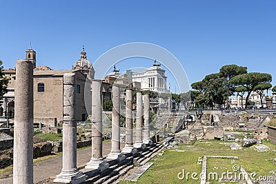 View of the excavations next to Basilica Emilia with Altar of the Fatherland in Rome in the background Editorial Stock Photo