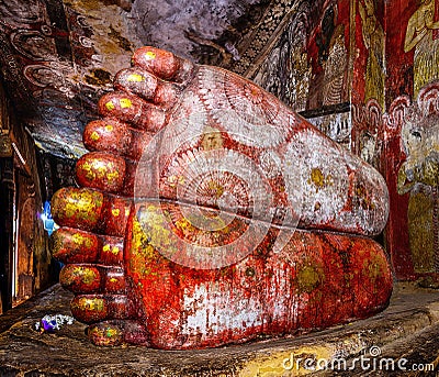View of feet of lying Buddha Statue inside cave Golden temple in Dambulla, Sri Lanka Editorial Stock Photo