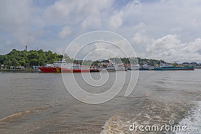 View from the ferry to Waisai at Sorong with boats at the pier Editorial Stock Photo