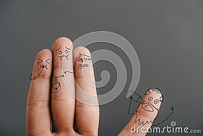 View of fingers as frightened women looking at drunk man isolated on grey Stock Photo