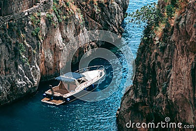 A view of the Fiordo of Furore in Amalfi coast, Travel and vacation concept, yacht with tourists for excursionsItaly. Watercraft Stock Photo