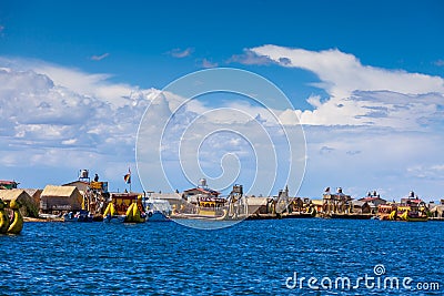 View of the floating islands of Uros, at a distance, clouds, on Lake Titicaca in Peru, South America. Editorial Stock Photo