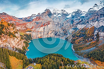 View from flying drone. Attractive autumn view of unique Oeschinensee Lake. Captivating morning scene of Swiss Alps with Bluemlisa Stock Photo