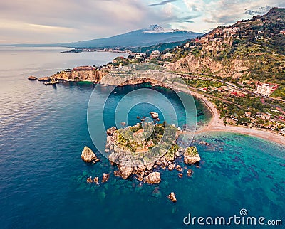 View from flying drone. Breathtaking morning view of Bella island and Etna volcano on background. Nice spring seascape of Mediterr Stock Photo
