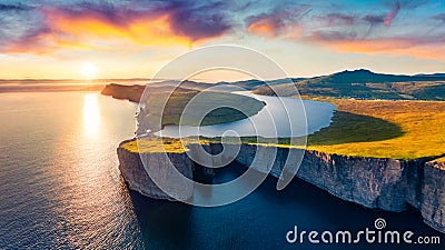 View from flying drone. Splendid evening scene of Sorvagsvatn lake, Vagar, Faroe Islands, Denmark, Europe. Unbelievable summer sun Stock Photo