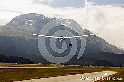 A view of a flying glider in the airport of St Moritz in the alps switzerland Stock Photo