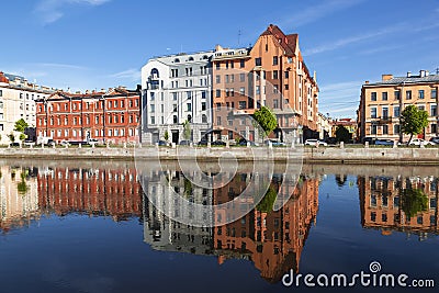 View of Fontanka and profitable houses on the waterfront with their reflection in the water. In the foreground is the profitable h Stock Photo