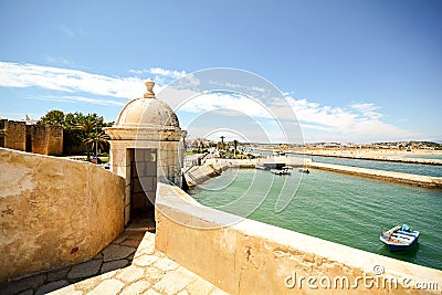 View from fortress Forte da Ponta da Bandeira in Lagos to waterfront with marina and old town, Algarve Stock Photo