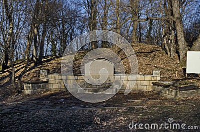 View of fountain with three tap in field above Demir Baba Teke, cult monument honored by both Christians and Muslims in winter Stock Photo