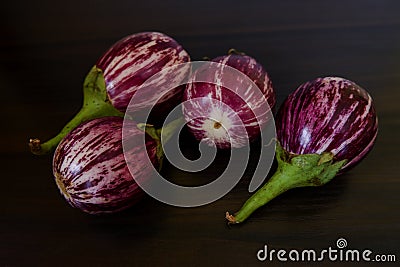 View of fresh brinjals group on kitchen table Stock Photo