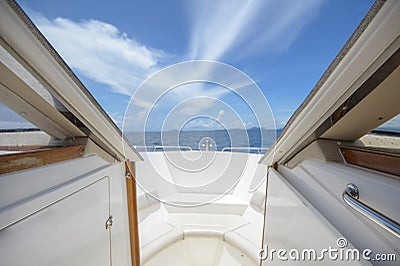 view of front luxury speedboat with a beautiful ocean and mountain in background Stock Photo