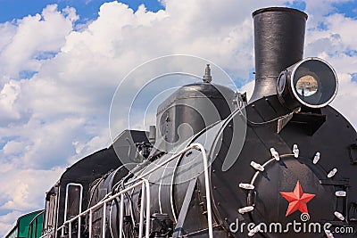 View of the front of the old steam locomotive with the smokestack, headlight and smokebox door Editorial Stock Photo