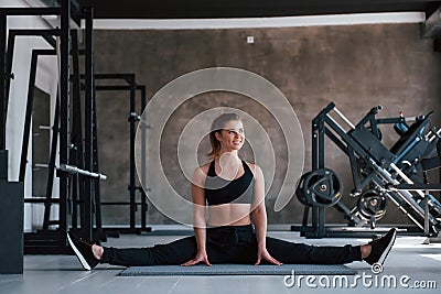 View from the front of she. Photo of gorgeous blonde woman in the gym at her weekend time Stock Photo