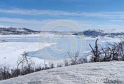 View of the frozen lake SlÃ¸ddfjorden near the village of HaugastÃ¸l, in the municipality of Hol, Viken County, Norway Stock Photo