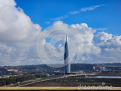 view of The futuristic Mohammed VI Tower It s the third tallest building in Africa. against sky and clouds - Rabat, Morocco Stock Photo