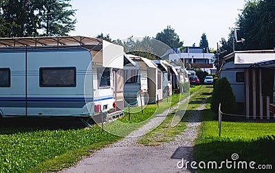 View of german camping place with tents, caravans, trailer park and cabin cottage houses Editorial Stock Photo