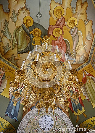 Gilded chandelier in the interior of the medieval chapel in the Alexander Svir Monastery in Karelia Editorial Stock Photo