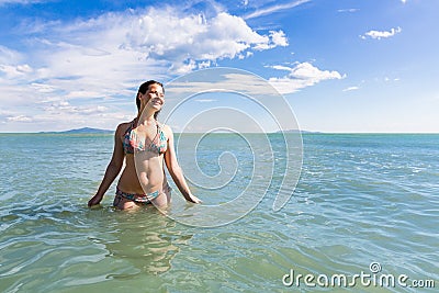 Girl at the natural beach Cala di Forno in Italy Stock Photo