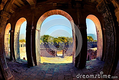 View of Girnar Hill - Guru Dattatreya peak through the arches of ancient Uparkot Fort in Junagadh Stock Photo