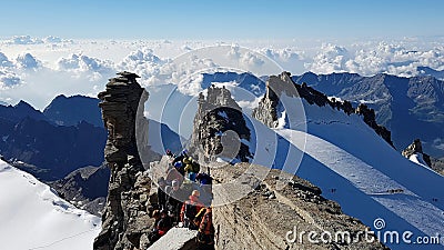View on glacier with climbers in line for the summit Editorial Stock Photo