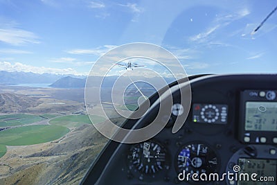 View from with glider glider cockpit while under tow from tow-plane Stock Photo