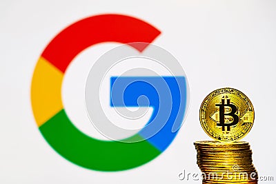 Gold Bitcoin coins with the Google logo on background Editorial Stock Photo