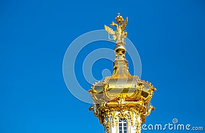 View of the Golden dome of the Orthodox Church with two-headed eagles, Peterhof Museum. St. Peter Stock Photo