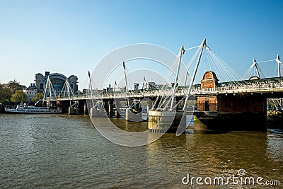 A view of Golden Jubilee and Hungerford bridges from South Bank of Thames River in London Editorial Stock Photo