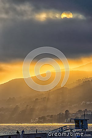 Golden hazy sunset on California beach. Stock Photo