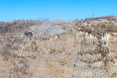 View of granite quarry. Pumping groundwater from quarry Stock Photo