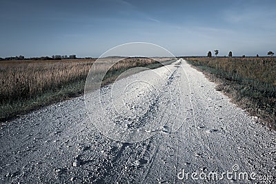 View of a gravel road, horizon and sky Stock Photo
