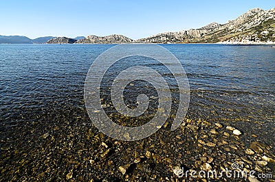 Gravely and clear sea by seaside in Hisaronu, Turkey Stock Photo