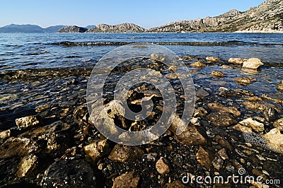 Gravely and clear sea by seaside in Hisaronu, Turkey Stock Photo