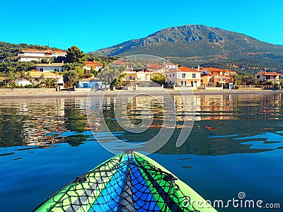 View of Greek Mountain and Fishing Village Reflected in Gulf of Corinth Water Stock Photo