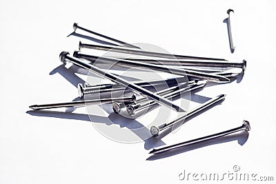 View of the group metallic iron nails fastener. in construction and carpentry, a slender metal shaft that is pointed at one end Stock Photo