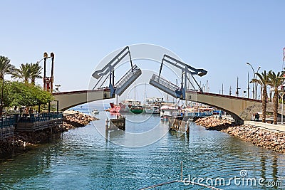 View of the Gulf of Eilat with luxury yachts. The moment of opening the bridge to exit the yacht from the bay Editorial Stock Photo