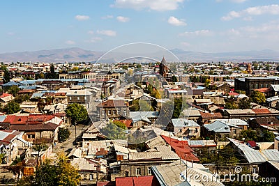 View on Gyumri city, Armenia with the dome of the church against the backdrop of the mountains Stock Photo