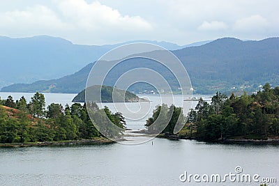 View of Halsnoy island in Vestland county, Norway. It lies between the Hardangerfjorden and SkÃ¥nevikfjorden Stock Photo