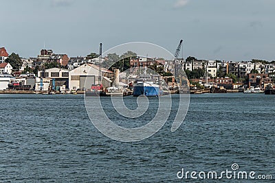 View of harbor from the old Boston Waterfront with fishing boat trucks and boats anchored Massachusets Stock Photo