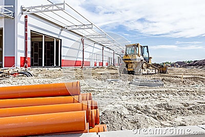 View on heavy bulldozer while he moving, leveling ground at cons Stock Photo
