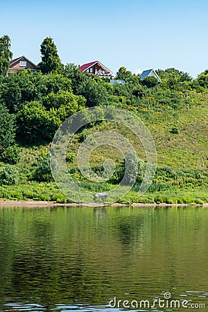 The picturesque bank of the Volga River from the ship. Stock Photo