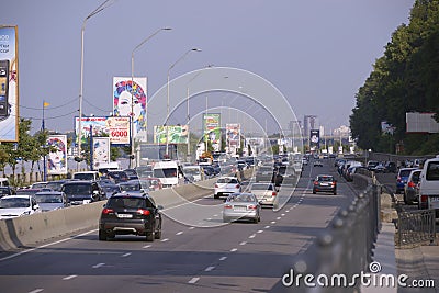 View of a highway, cars driving, Dnieper river aside Editorial Stock Photo