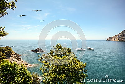 View from hiking trail to beautiful coastline and beach of mediterranean sea near village Monterosso al Mare in early summer, Stock Photo