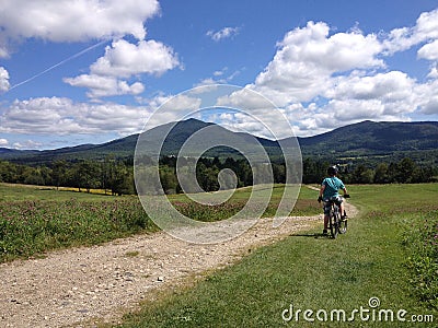 Boy enjoys the view on a bike ride Stock Photo